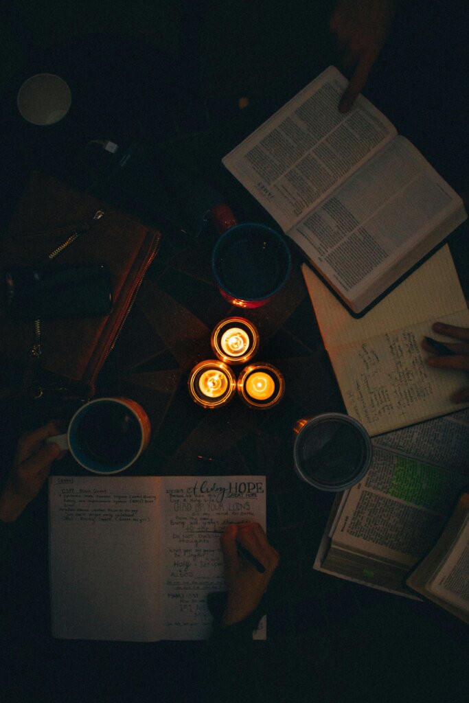 pexels-photo-1557251-1557251 A moody, candle-lit study session with open books and notes, perfect for cozy learning vibes.